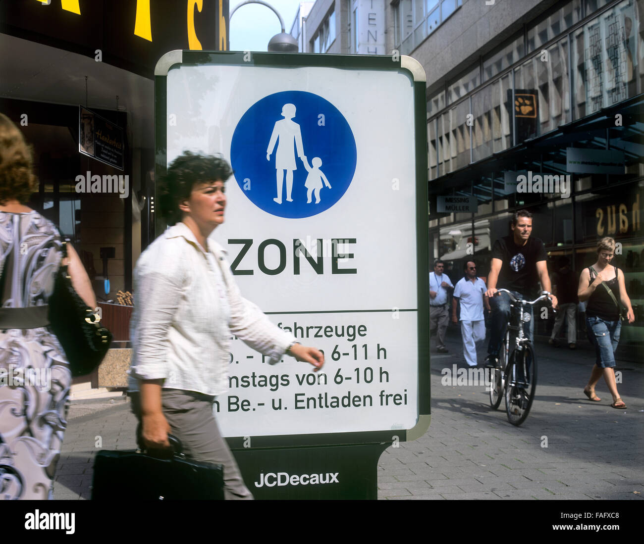 A 'Pedestrian Zone' sign at the beginning of a pedestrianised part of Minoritenstrasse in Cologne city centre, Germany Stock Photo