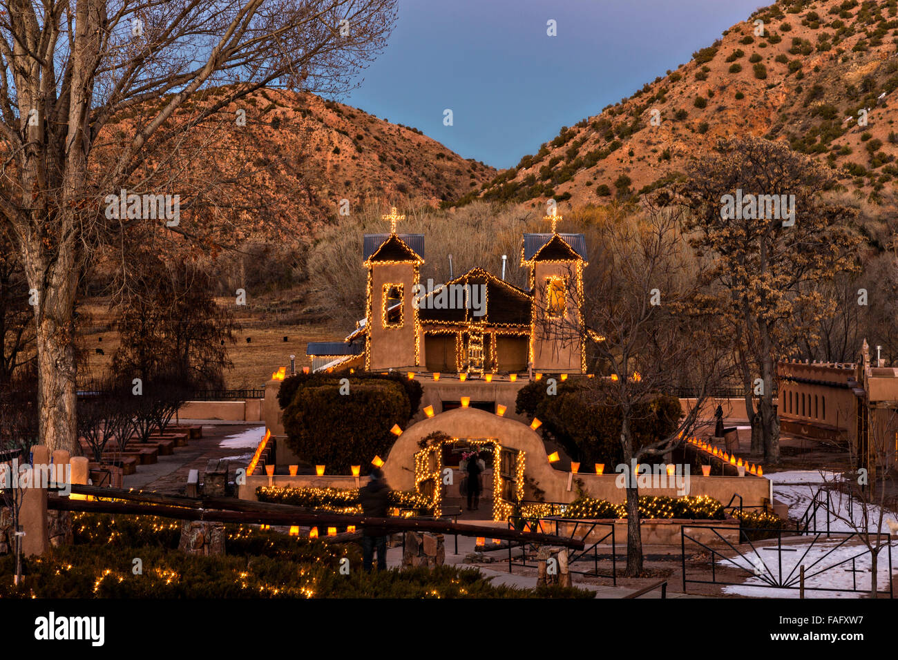 El Santuario de Chimayo Historic Site illuminated by hundreds of small paper lanterns known as luminaria to celebrate the holiday season December 13, 2015 in Jemez Springs, New Mexico. Each year 30,000 people make pilgrimages to the shrine. Stock Photo