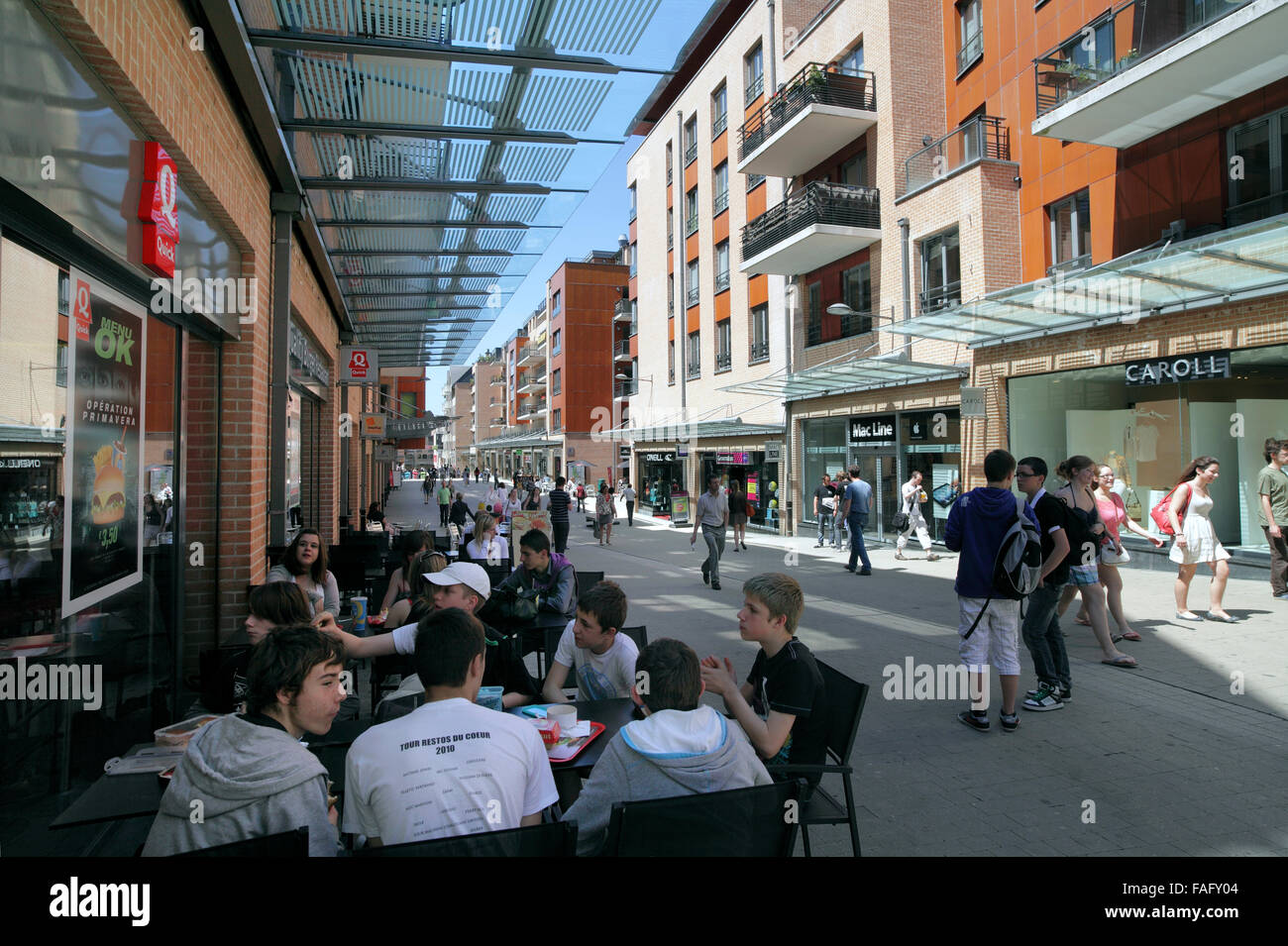 A pavement cafe on Rue Charlemagne in the centre of Louvain-la-Neuve, a Belgian new town with a traffic-free town centre. Stock Photo