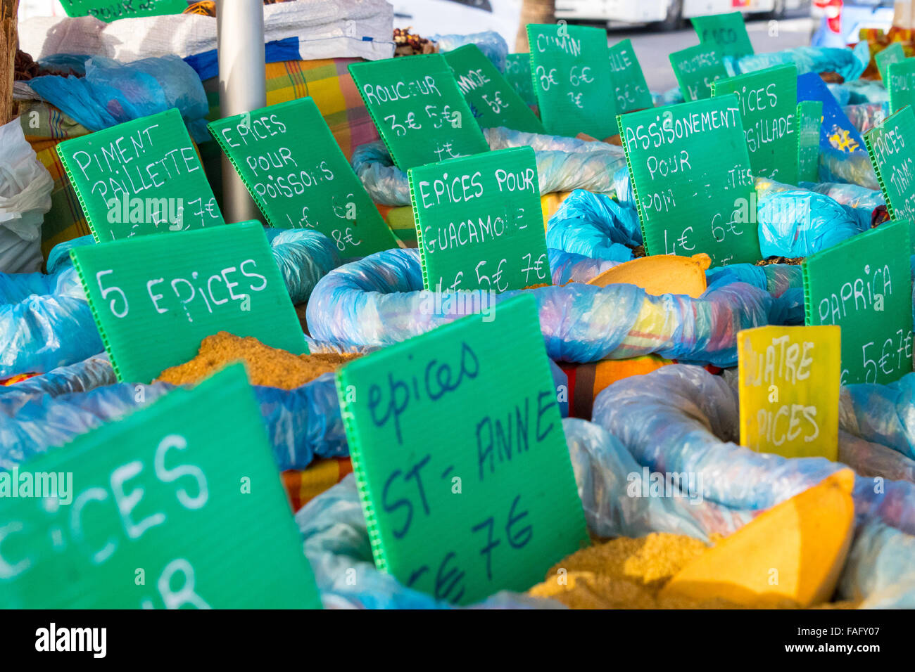 Market stall with several flavored spices bags with price tags, colorful. Stock Photo