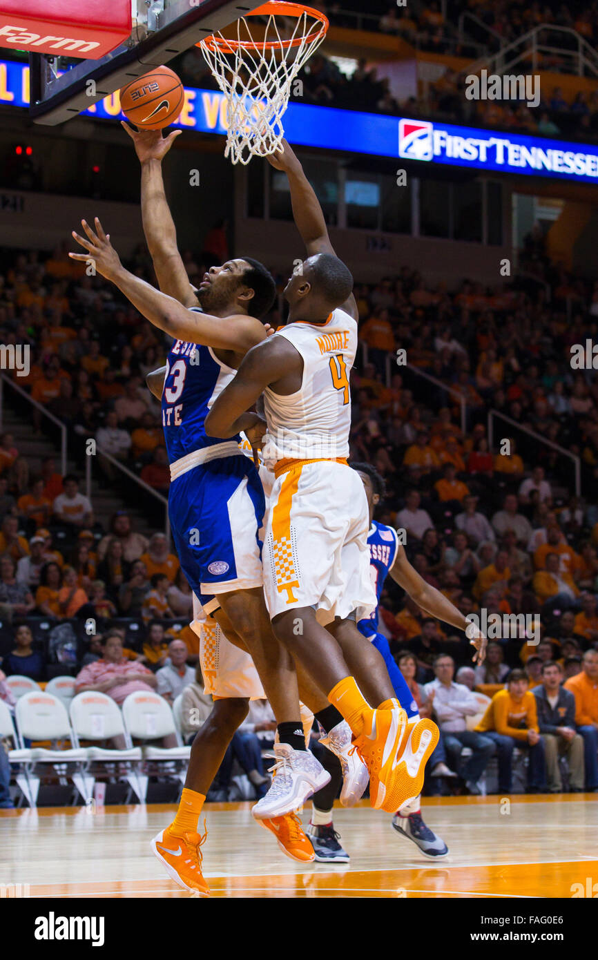 Knoxville, Tennessee, USA. 29th Dec, 2015. Wayne Martin #33 of the Tennessee State Tigers shoots the ball over Armani Moore #4 of the Tennessee Volunteers during the NCAA basketball game between the University of Tennessee Volunteers and the Tennessee State University Tigers at Thompson Boling Arena in Knoxville TN  Credit:  Tim Gangloff/Cal Sport Media/Alamy Live News Stock Photo