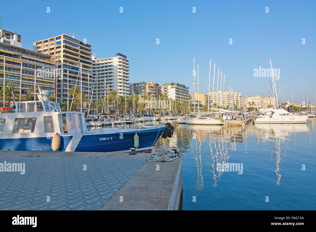 Boats in the Palma marina and hotel Tryp Bellver on a sunny day on December 20, 2015 in Palma de Mallorca, Spain Stock Photo