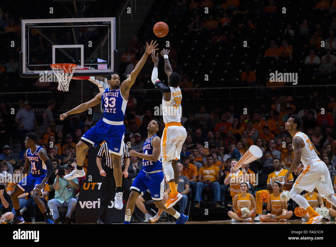 Knoxville, Tennessee, USA. 29th Dec, 2015. Devon Baulkman #34 of the Tennessee Volunteers shoots the ball over Wayne Martin #33 of the Tennessee State Tigers during the NCAA basketball game between the University of Tennessee Volunteers and the Tennessee State University Tigers at Thompson Boling Arena in Knoxville TN  Credit:  Tim Gangloff/Cal Sport Media/Alamy Live News Stock Photo