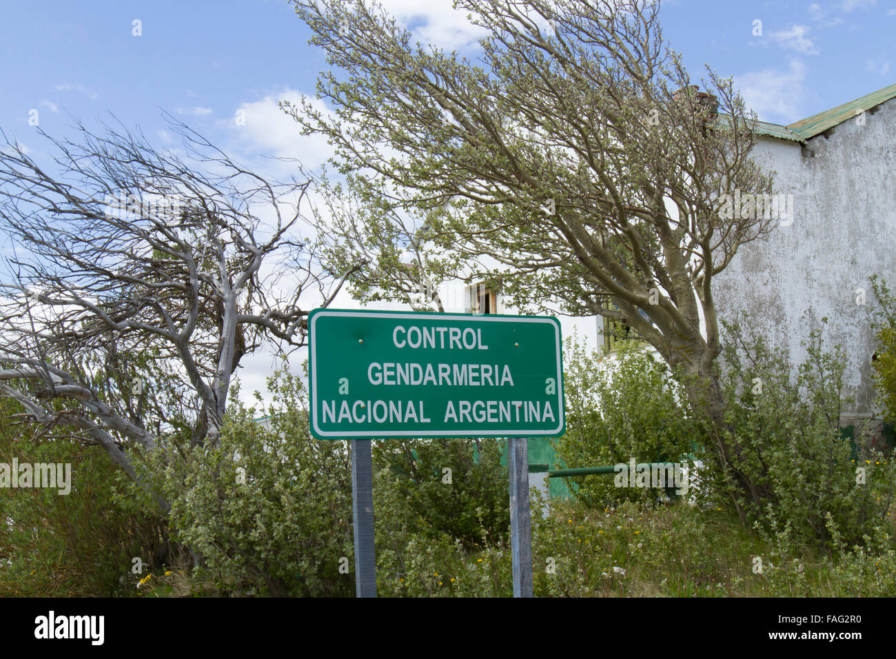 Argentina border control sign next to abandoned outpost. Stock Photo