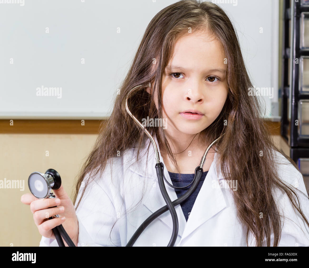 Young girl doctor in lab coat with a stethoscope Stock Photo Alamy