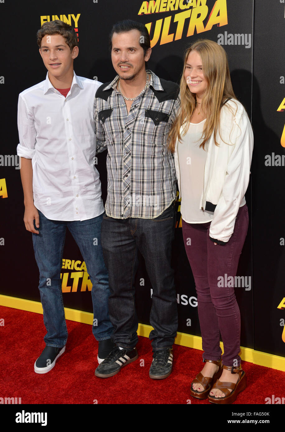 LOS ANGELES, CA - AUGUST 18, 2015: John Leguizamo & children Ryder & Allegra at the world premiere of his movie 'American Ultra' at The Ace Hotel Downtown. Stock Photo