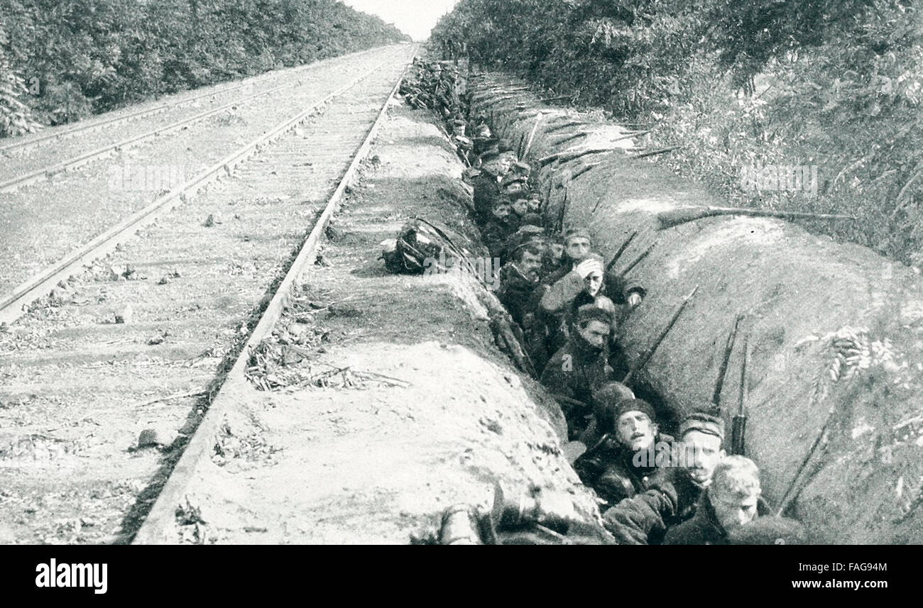 Belgian Soldiers intrenched along a railway line. The fine roads and railways of Belgium and France aided the rapid advance of the invaders, World War I Stock Photo