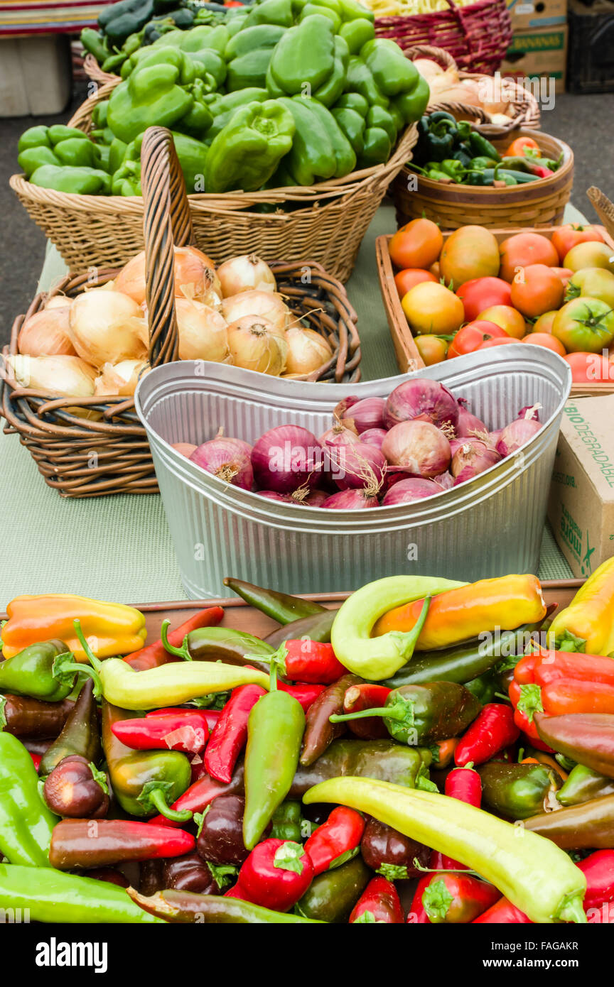 Display of fresh produce including peppers, onions and tomatoes at a farmers market in Beaverton, Oregon, USA Stock Photo