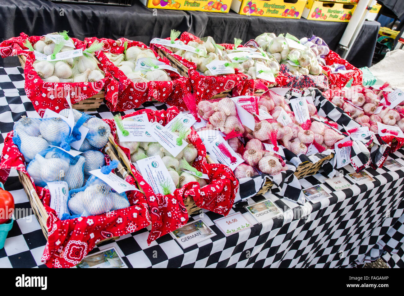 Display of garlic in mesh bags at a farmer's market in Beaverton, Oregon, USA Stock Photo