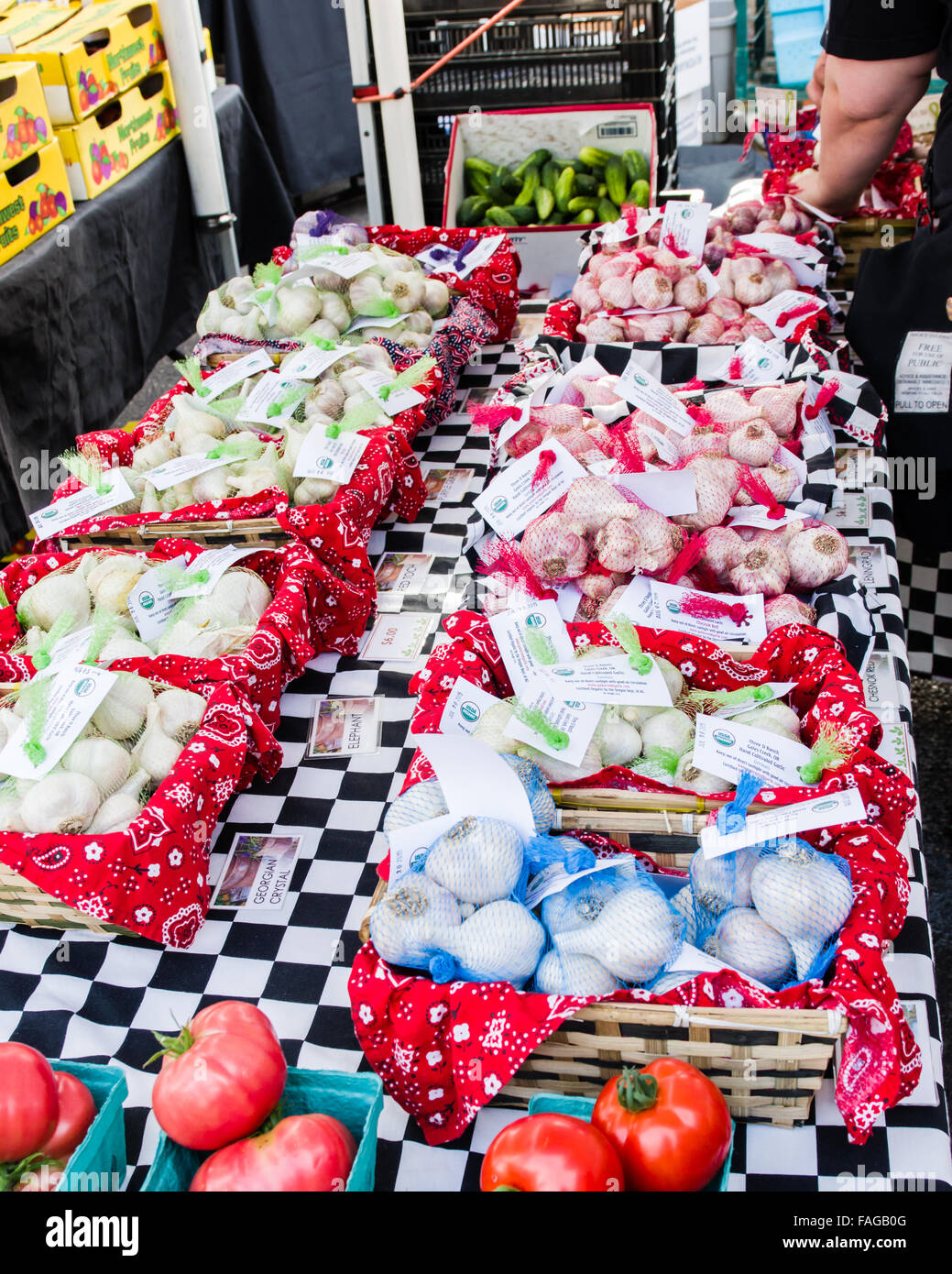 Display of garlic in mesh bags at a farmer's market in Beaverton, Oregon, USA Stock Photo