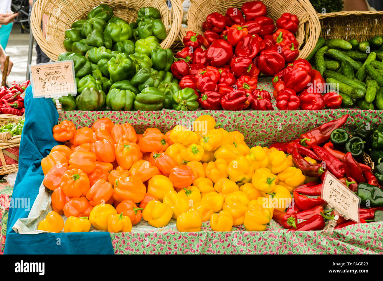 Display of colorful bell peppers including red, orange, yellow and green at a farmers market in Beaverton, Oregon, USA Stock Photo