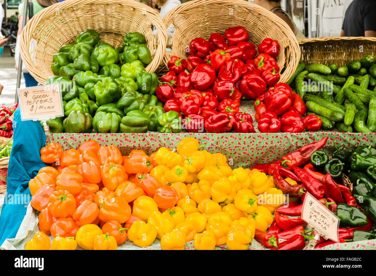 Display of colorful bell peppers including red, orange, yellow and green at a farmers market in Beaverton, Oregon, USA Stock Photo
