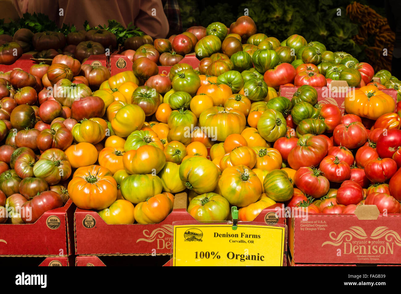 Heirloom tomatoes in boxes on display at a farmer's market in Beaverton, Oregon, USA Stock Photo