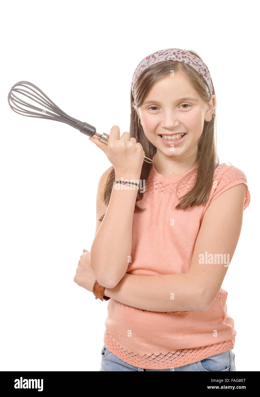 a pretty young girl with a whisk for cooking Stock Photo Alamy