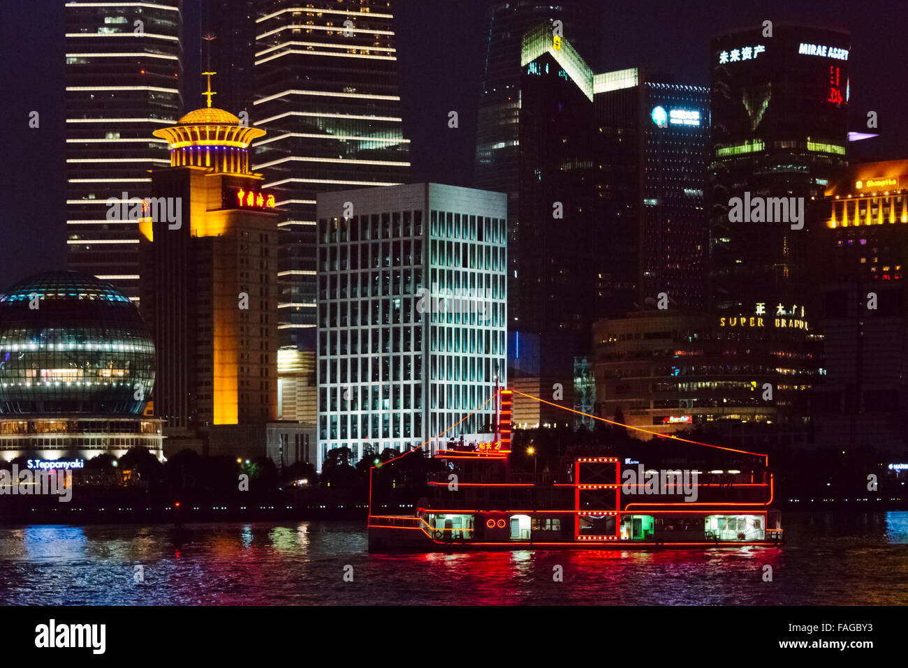 Night view of high rises in Pudong and cruise ship on Huangpu River ...