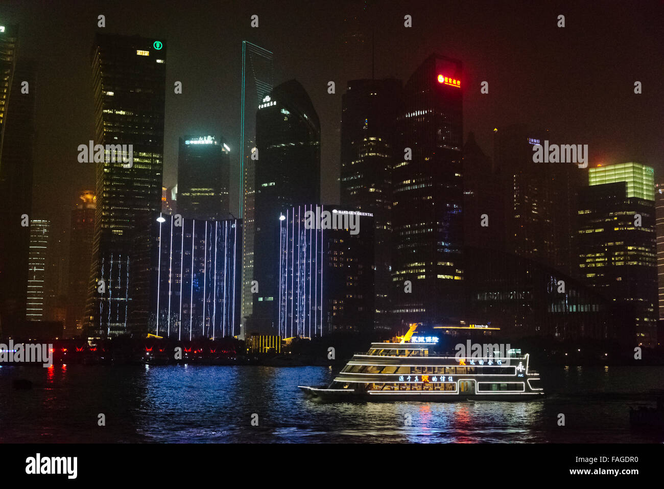 Night view of high rises in Pudong and cruise ship on Huangpu River ...
