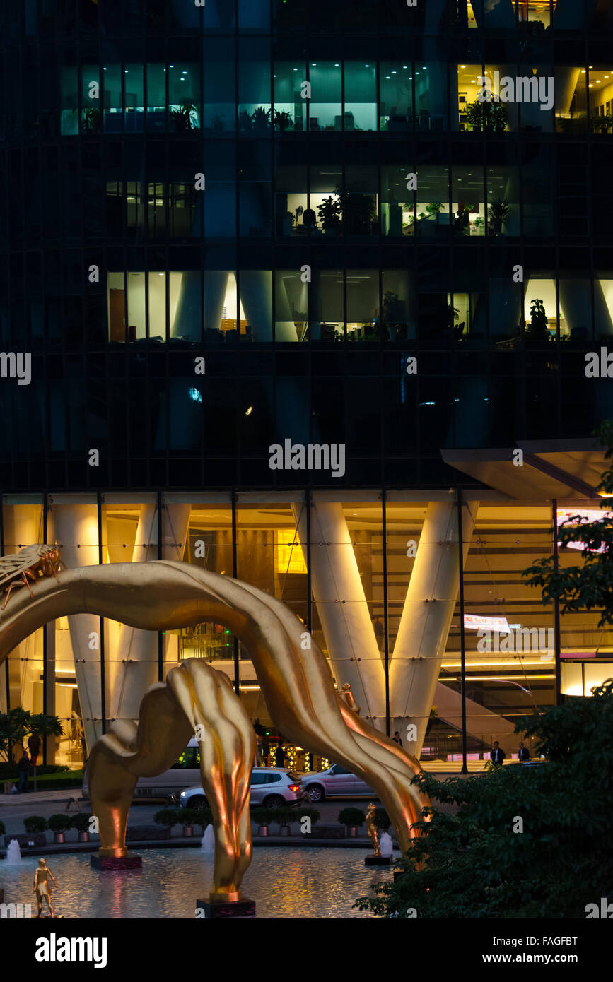 Golden statue of cicada in front of Guangzhou International Finance Center (previously called Guangzhou West Tower), Guangzhou, Stock Photo