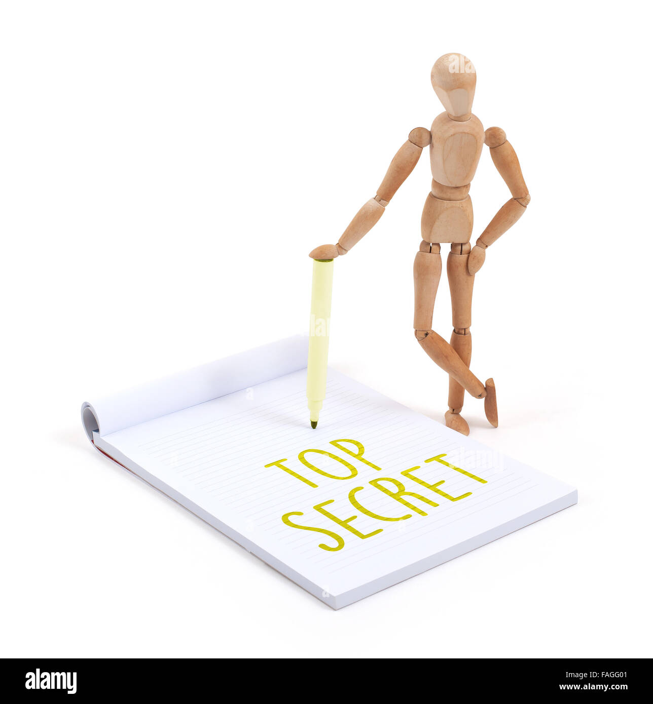 Wooden mannequin writing in a scrapbook - Top secret Stock Photo - Alamy