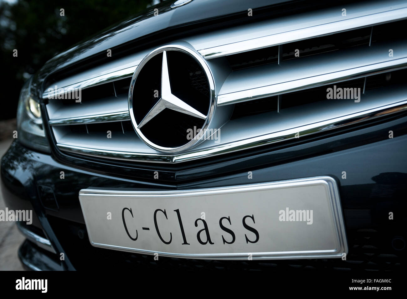 A close-up photo of front part of the Mercedes Benz c-class sedan Stock Photo