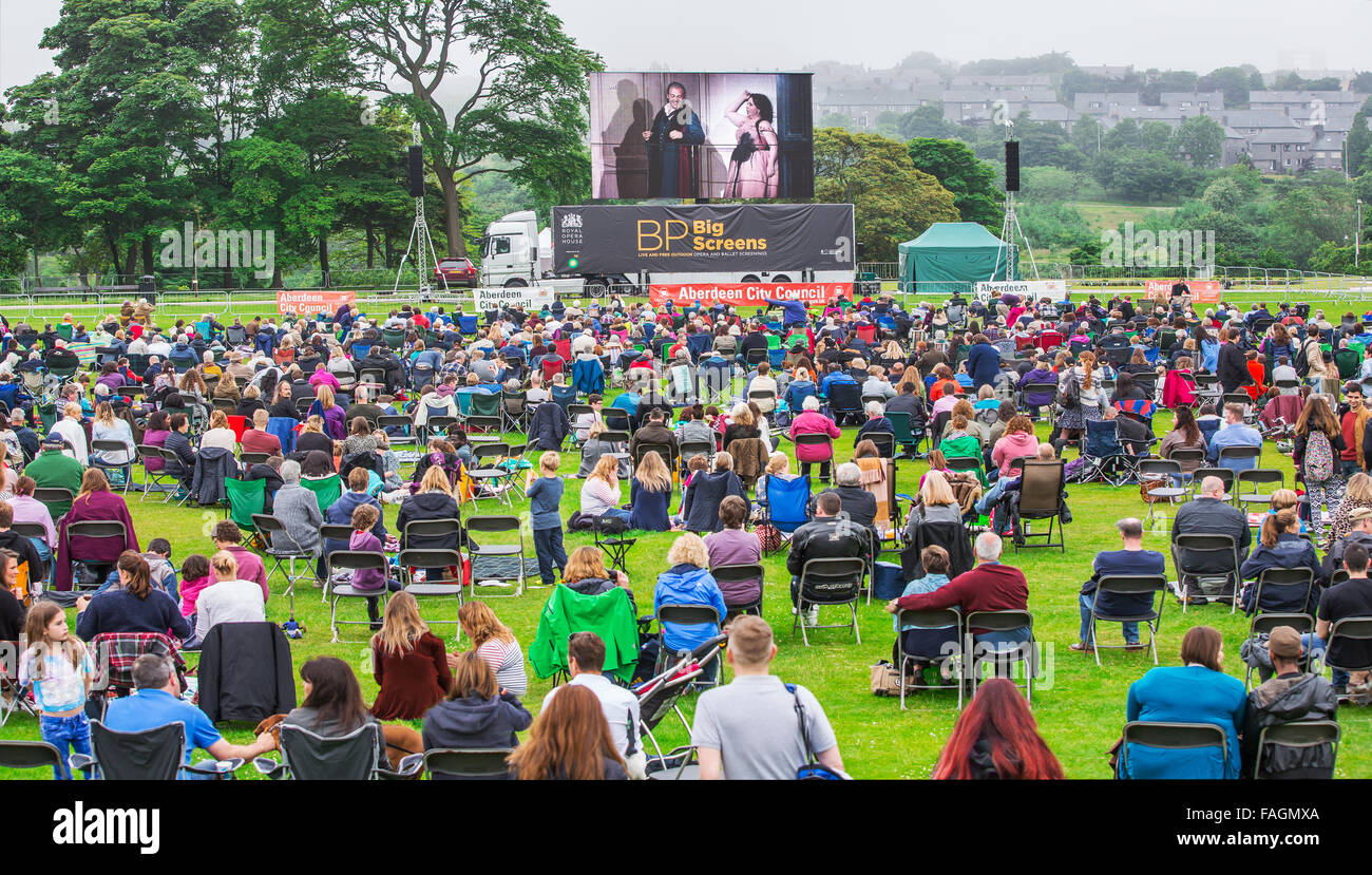People watch the BP Big Screen event relaying opera in Duthie Park in the city of Aberdeen, Scotland, UK Stock Photo
