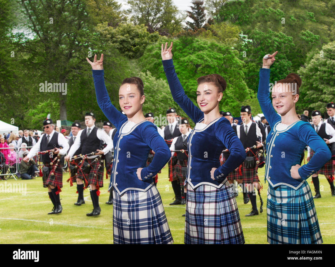 Highland dancers and a pipe band at the Highland Games in Aberdeen, Scotland, UK Stock Photo