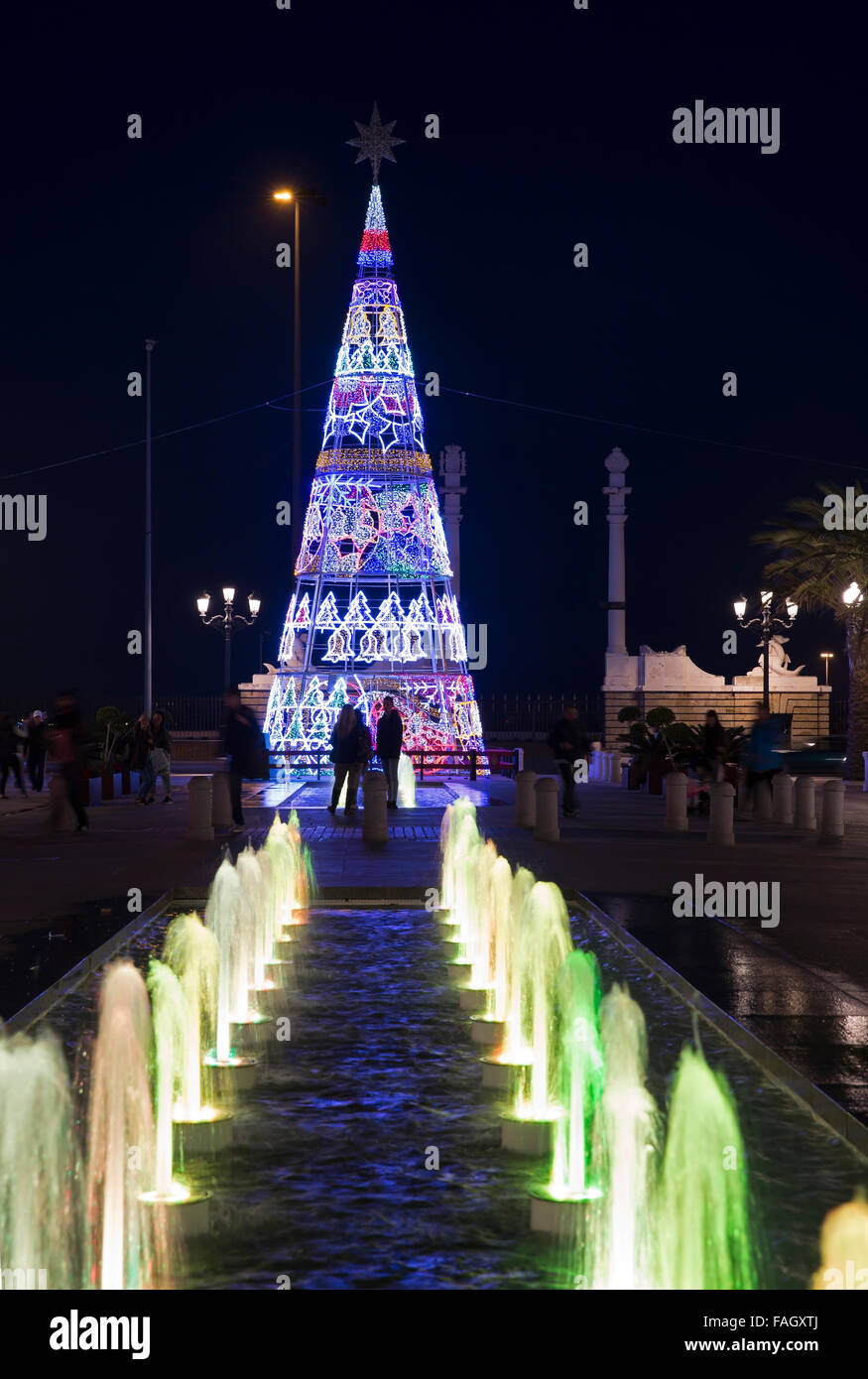 Christmas tree and coloured water fountains at night in Cadiz Spain