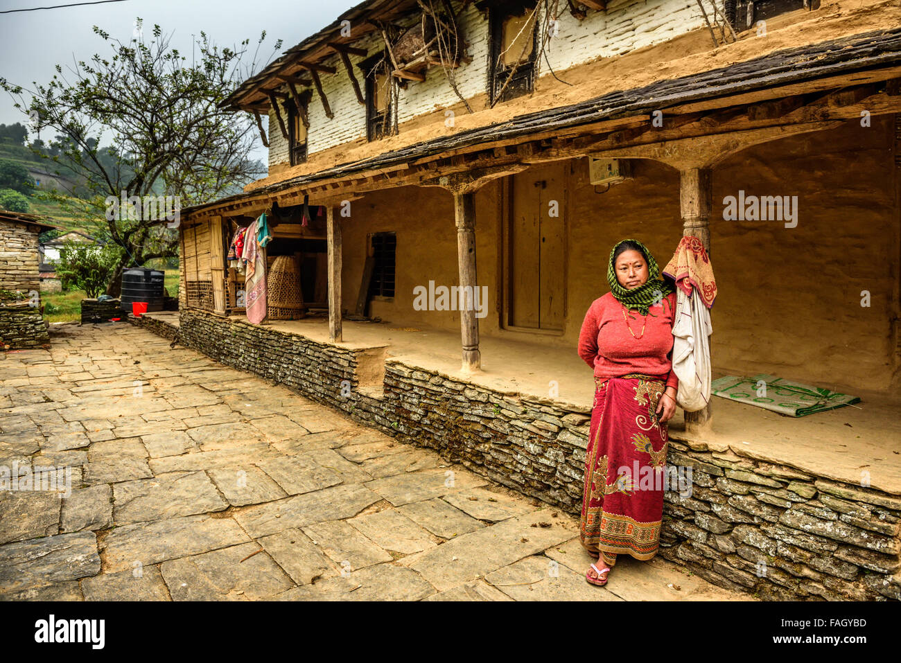 Nepalese lady in the backyard of her house Stock Photo