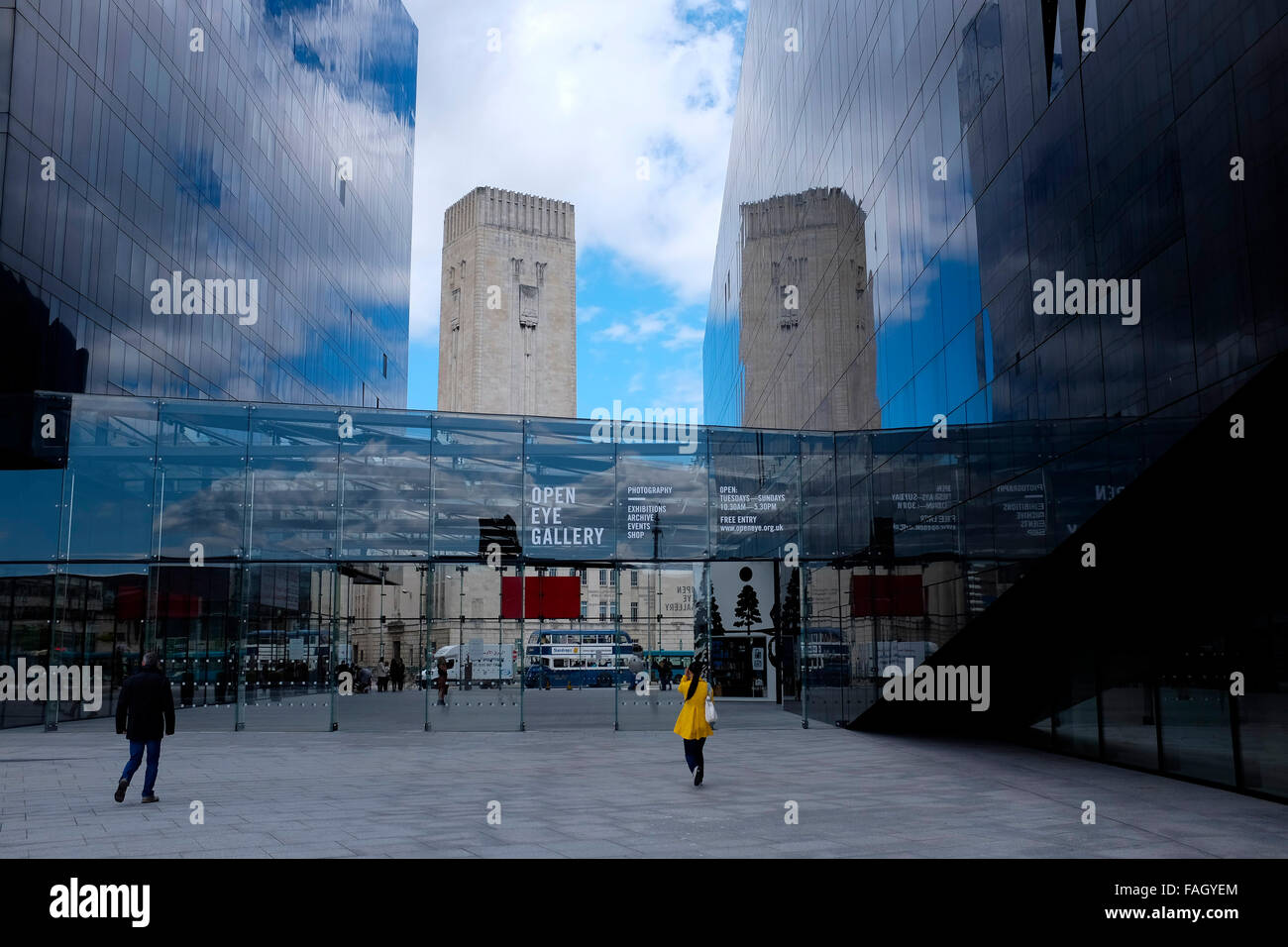 Walking towards the open eye gallery in Liverpool city center, with a ventilation shaft for the Mersey tunnel reflected. Stock Photo