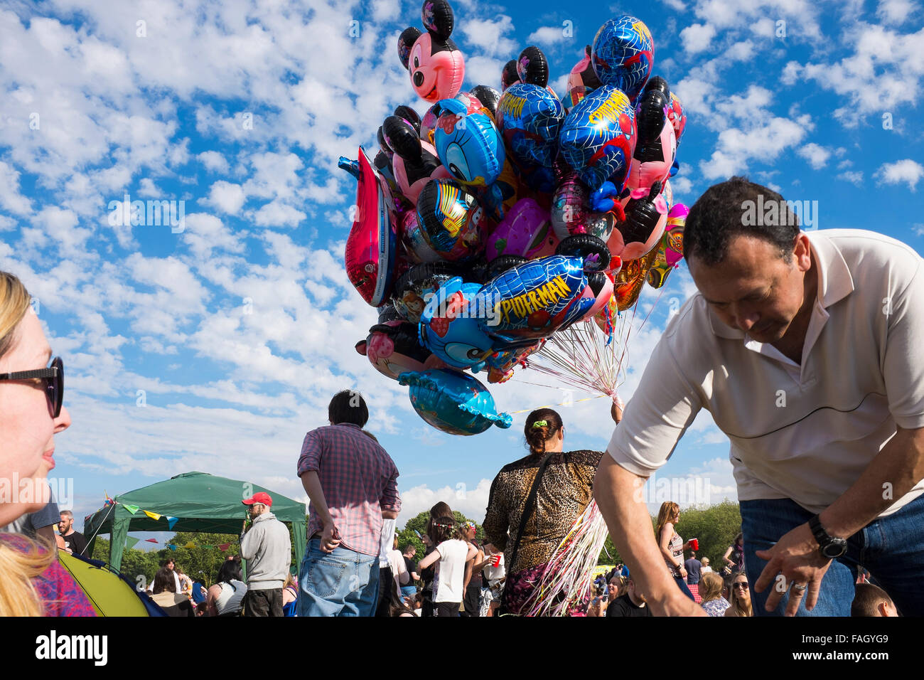 Selling balloons in the crowd at the annual Africa Oye festival in Liverpool, one of the UK's largest free summer music festivals Stock Photo