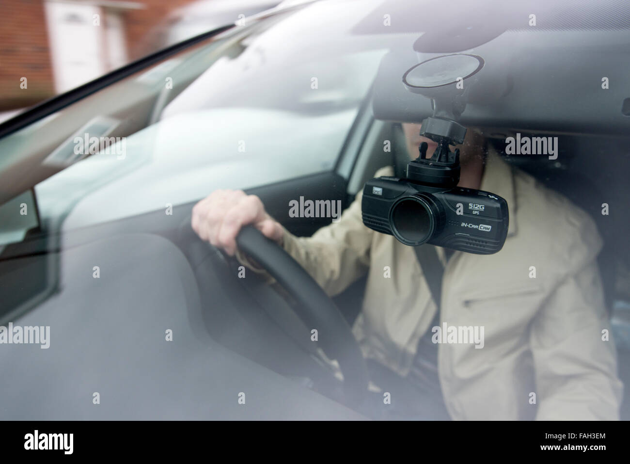 Driving a car with a dashcam video camera watching the road ahead Stock