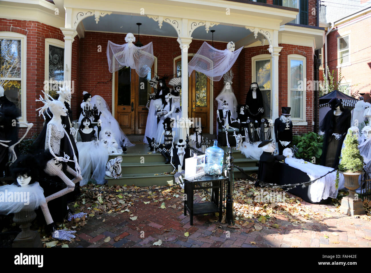 The front of a house decked with lots of life size figures and models as part of an impressive Beetle juice style Halloween decoration Stock Photo