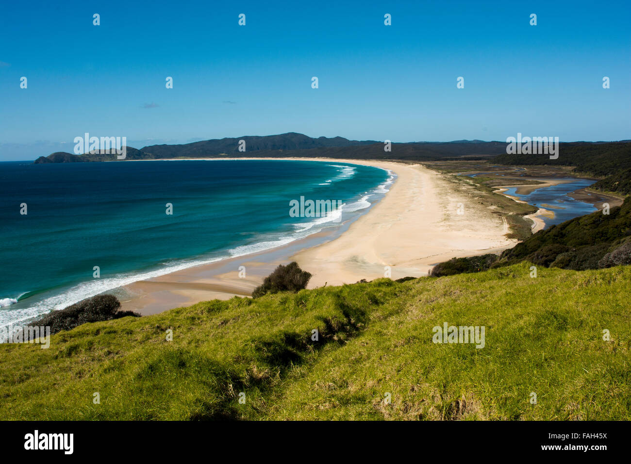 Waitahora Lagoon is just behind the twelve kilometer wide Spitirs Bay in the far north of New Zealand. Stock Photo