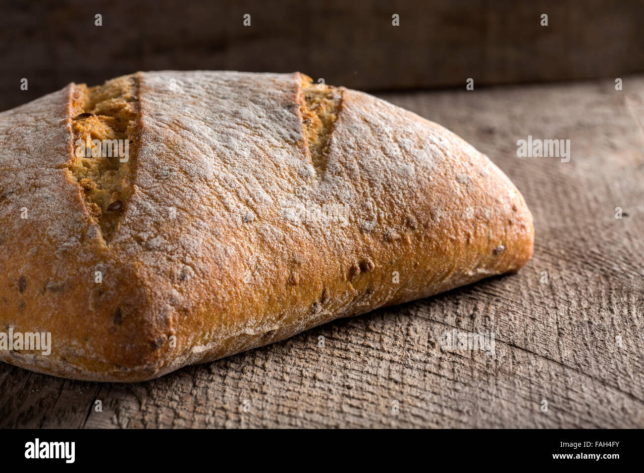 Bread rye on an old wooden background Stock Photo