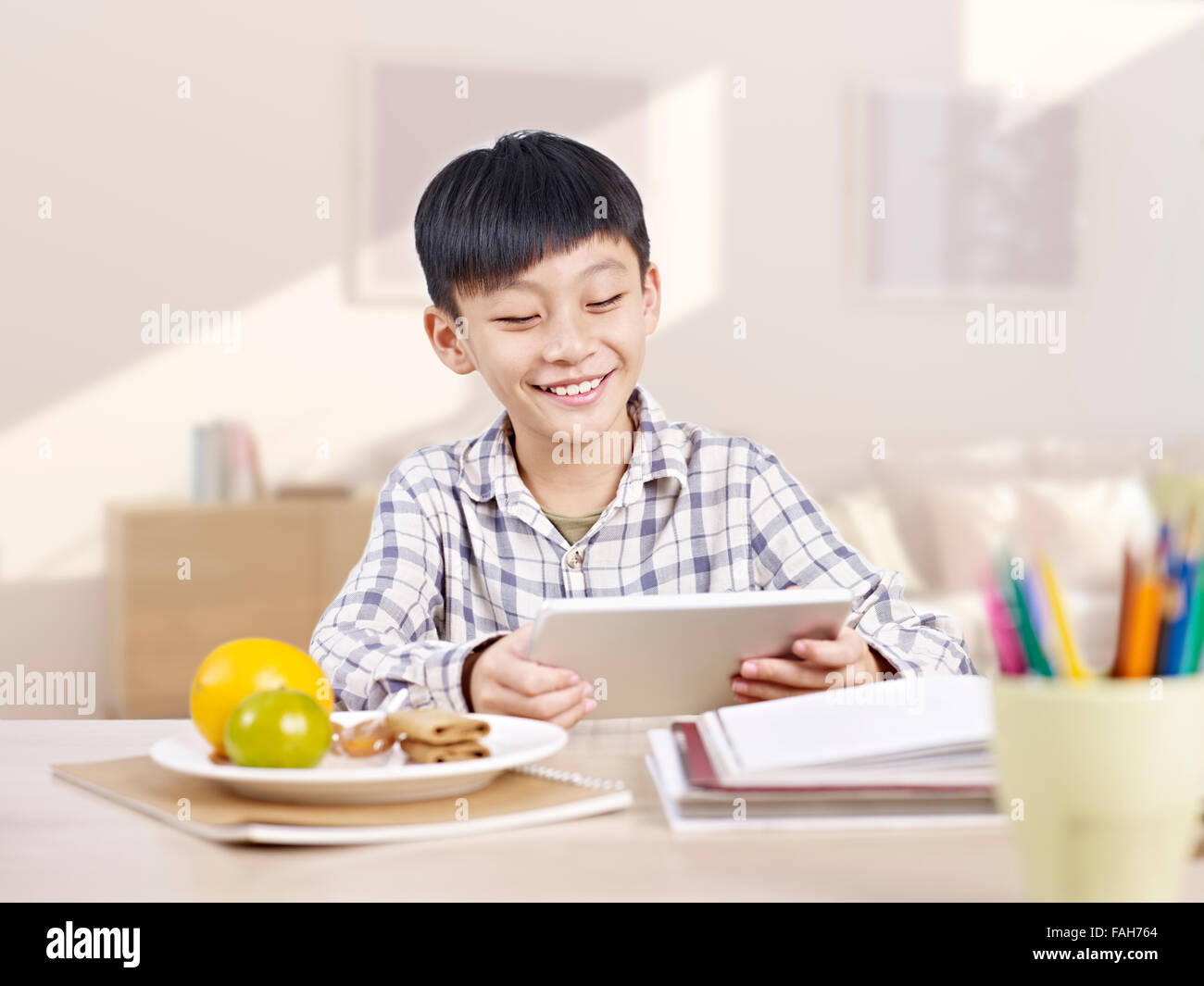 asian boy using tablet Stock Photo