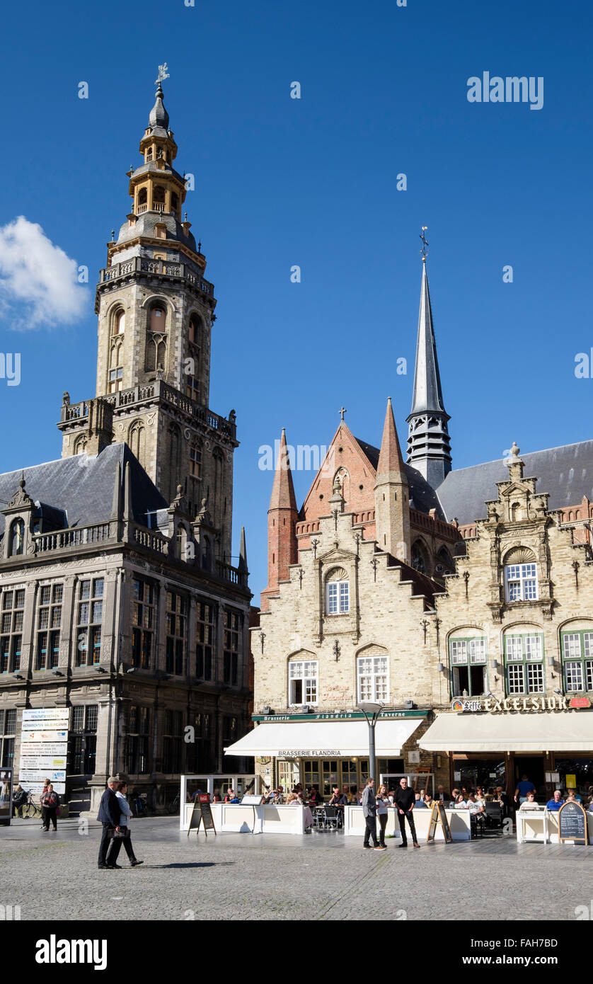 Belfry and restaurants in old Renaissance style buildings around town market square. Grote Markt Veurne West Flanders Belgium Stock Photo