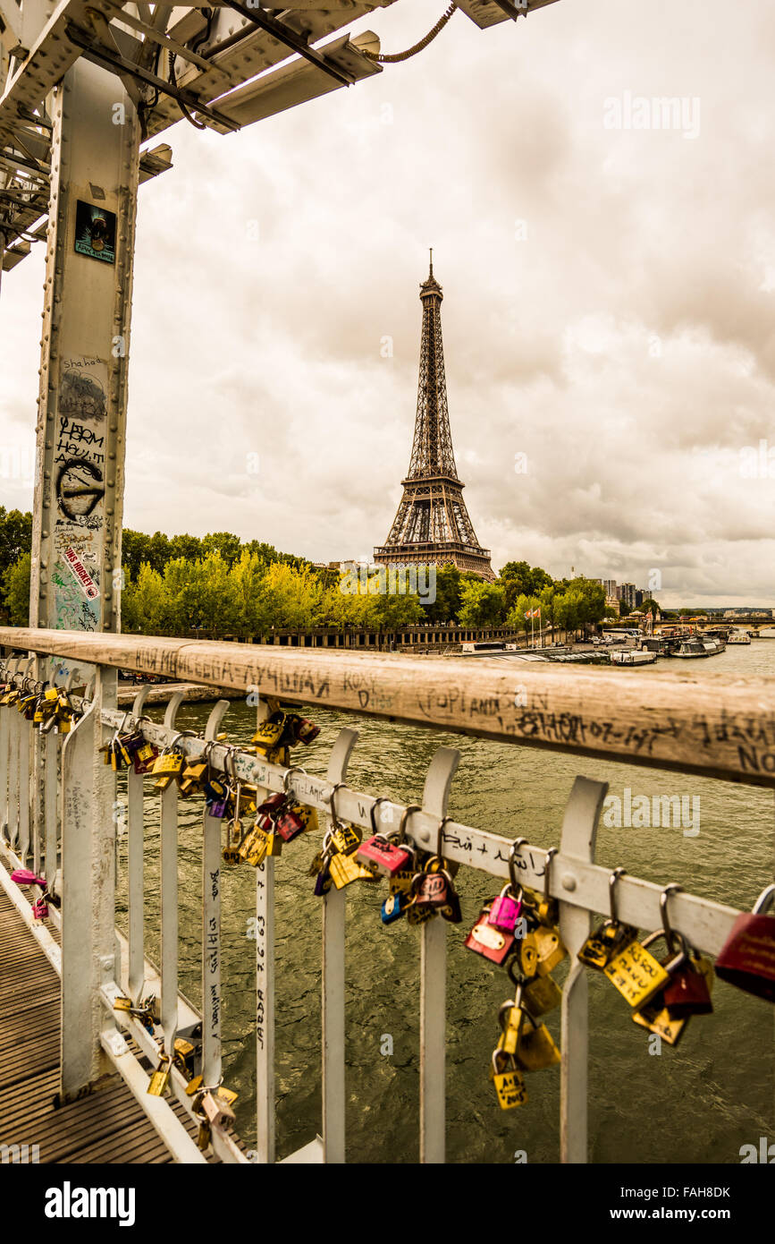 A view of the Eiffel Tower from a love lock bridge in the city of Paris France Stock Photo Alamy