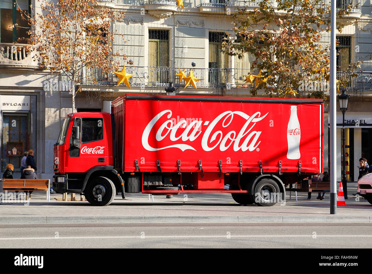 Red Coca-Cola delivery truck parked in the street, in the Passeig de Gracia at Barcelona, Stock Photo