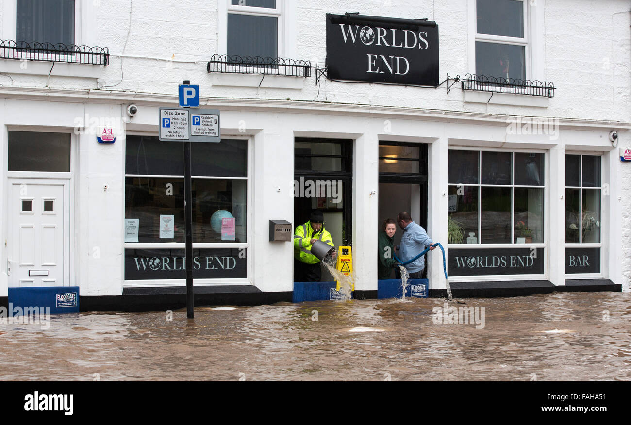 Whitesands, Dumfries, Scotland, UK. 30th Dec, 2015. Worlds End bar on the Whitesands, Dumfries, Scotland, bailing out water from inside pub Credit:  South West Images Scotland/Alamy Live News Stock Photo