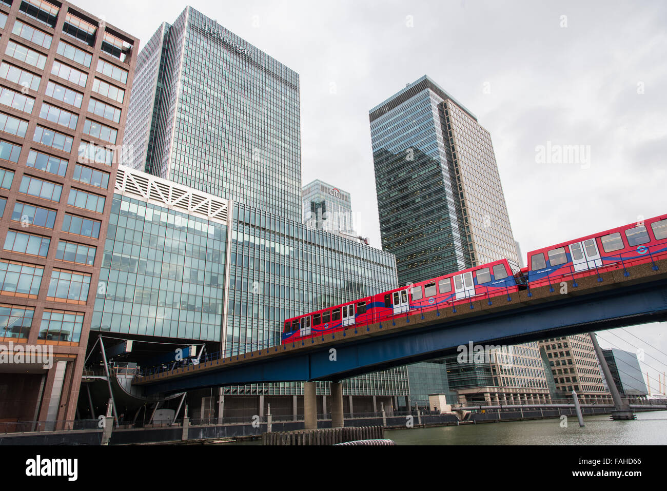 Docklands Light Railway, DLR,  metro  entering the station  located inside the modern skyscrapers at Docklands area in  Canary wharf district, London Stock Photo