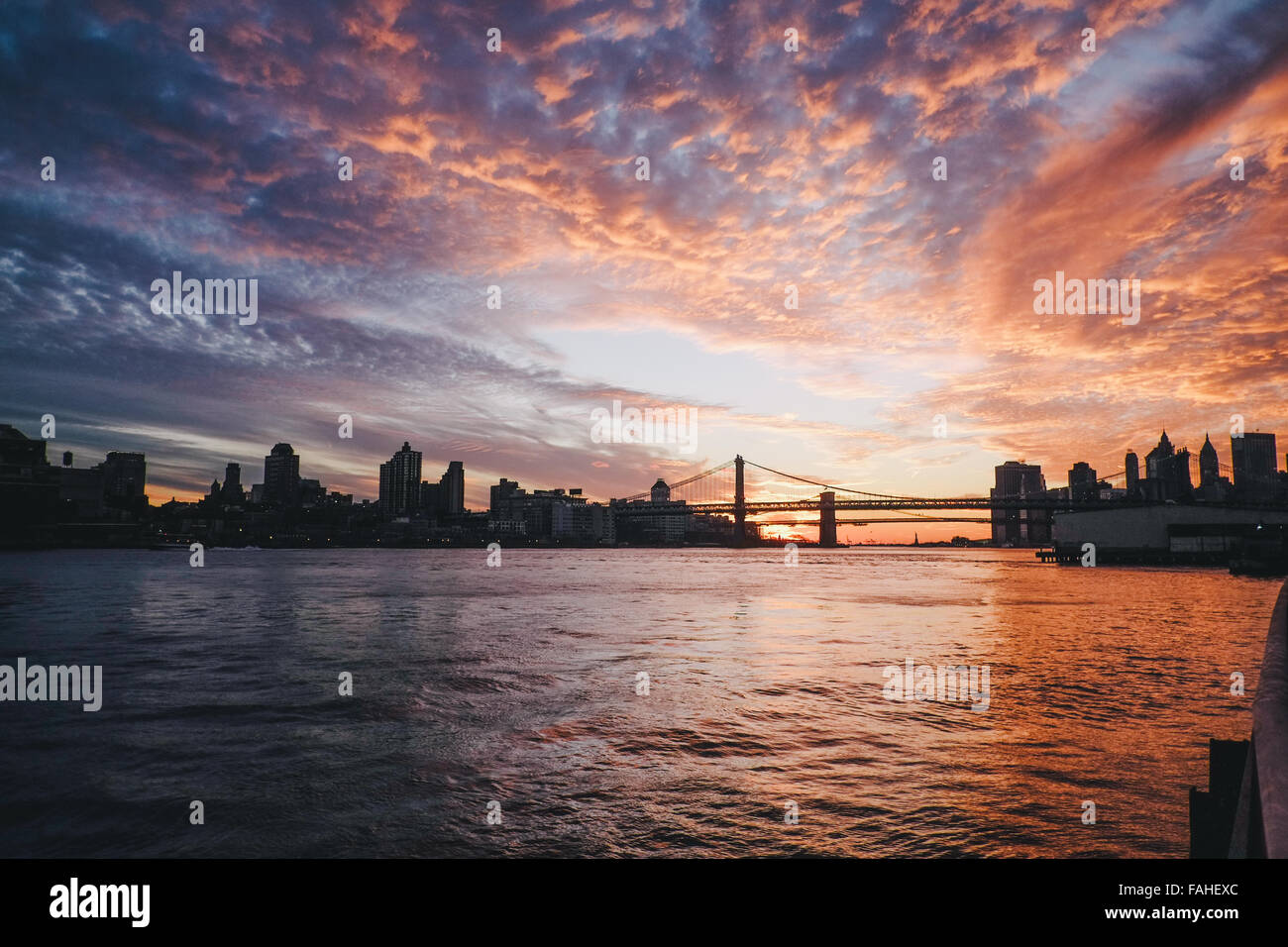 Sunset of New York skyline Stock Photo - Alamy