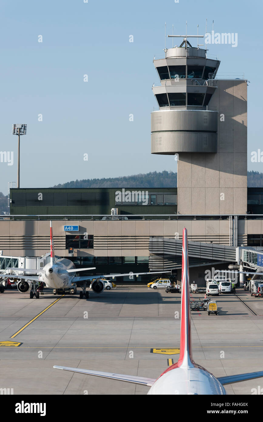 Air traffic control tower, terminal building and airfield of Zurich international airport (Zurich Kloten, Switzerland). Stock Photo
