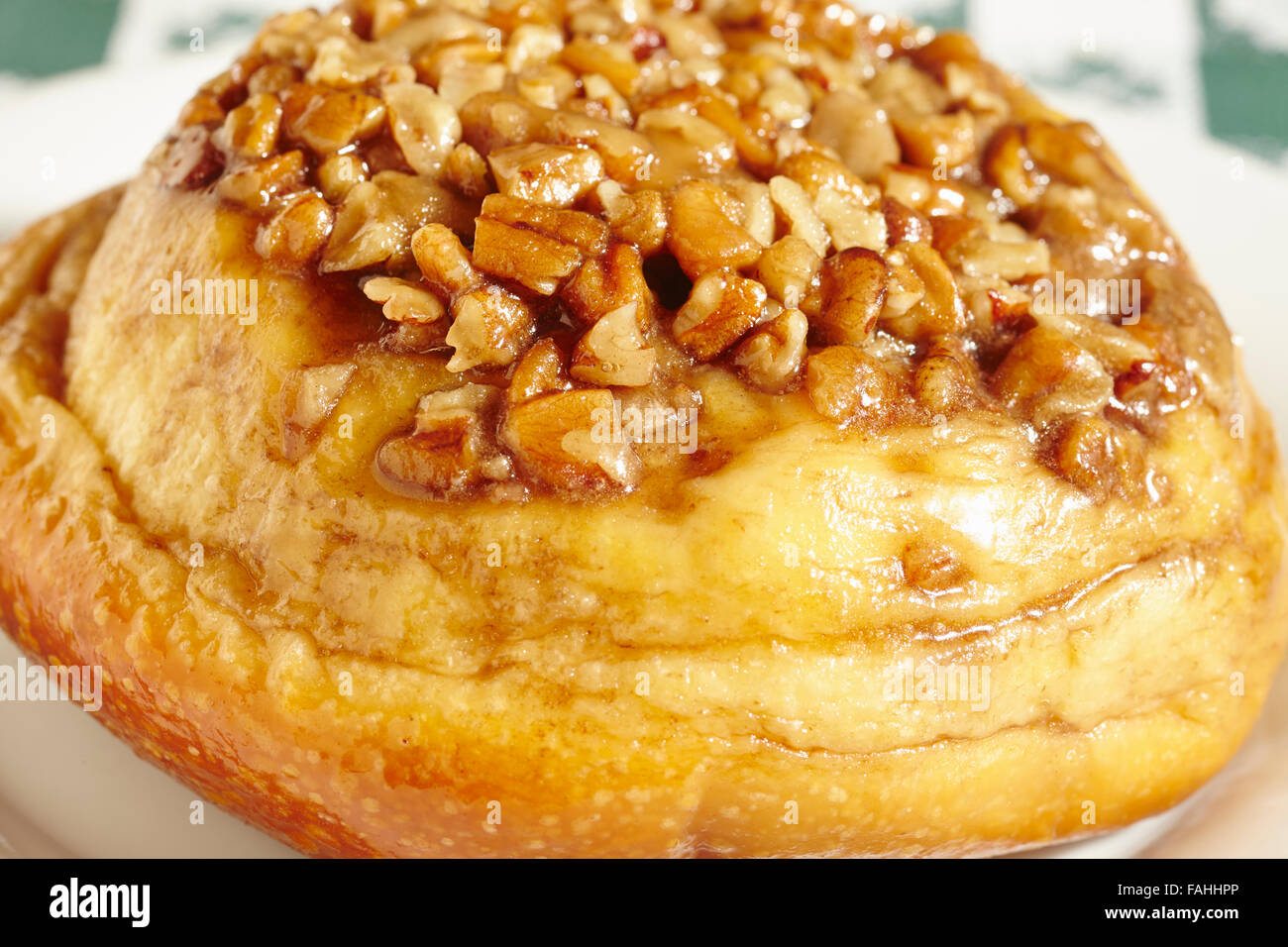Sticky bun with nut topping Stock Photo