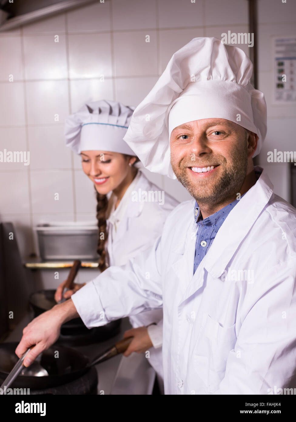 Happy female chef utensils hi-res stock photography and images - Alamy