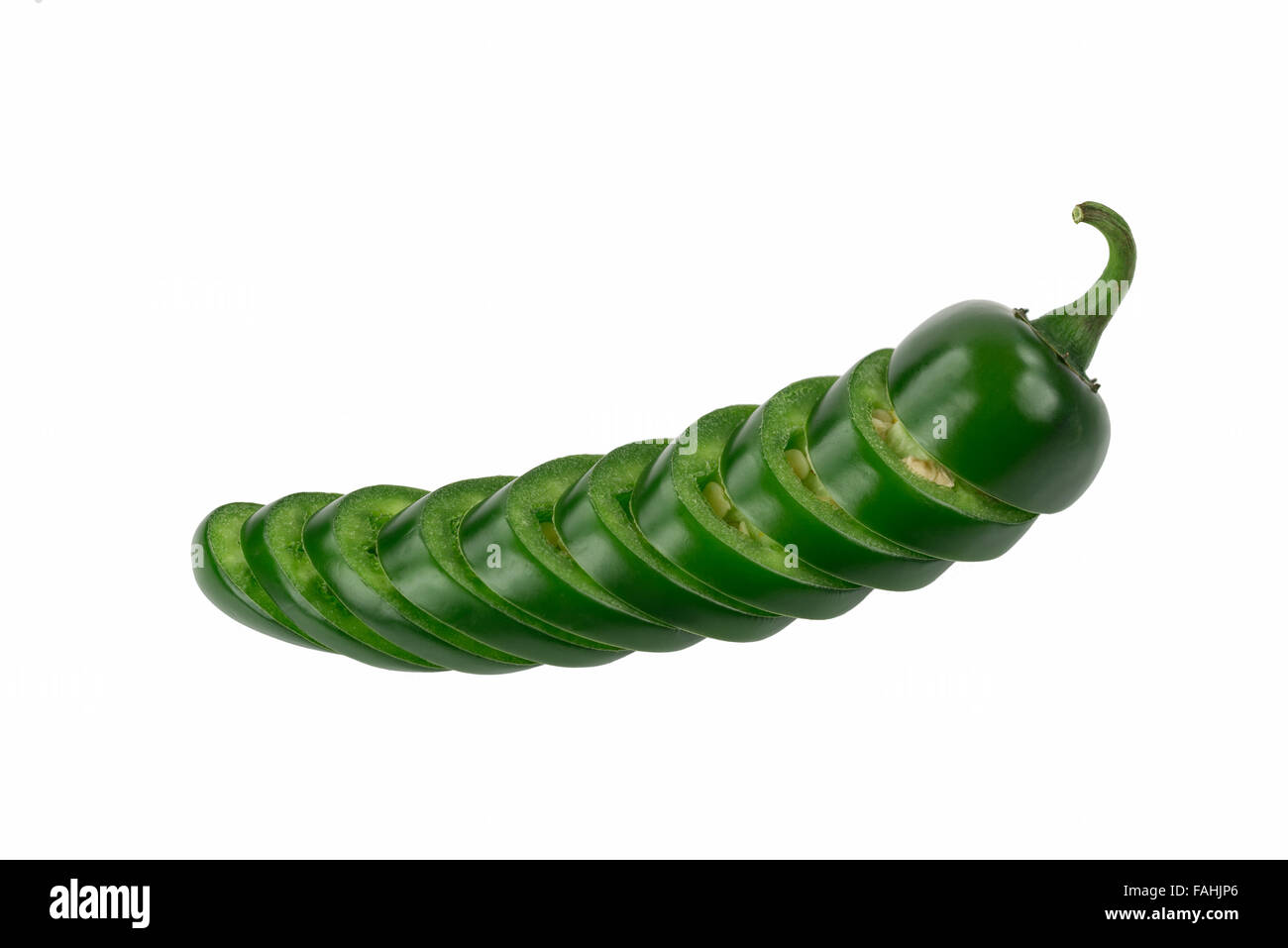 Single Sliced Green Jalapeno stacked in pepper shape isolated on white. Stock Photo