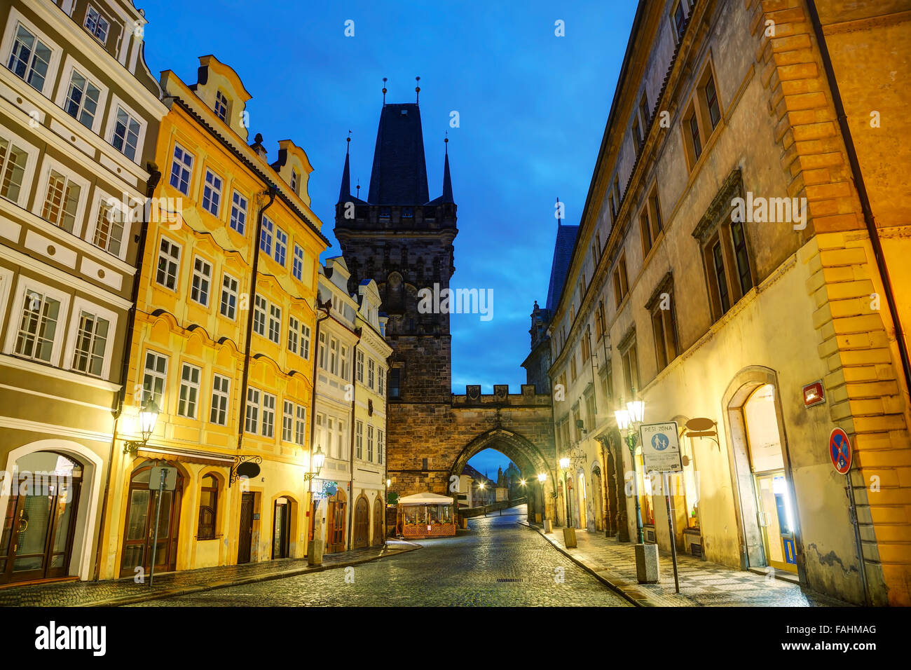 Old Prague street with Charles bridge in the morning Stock Photo