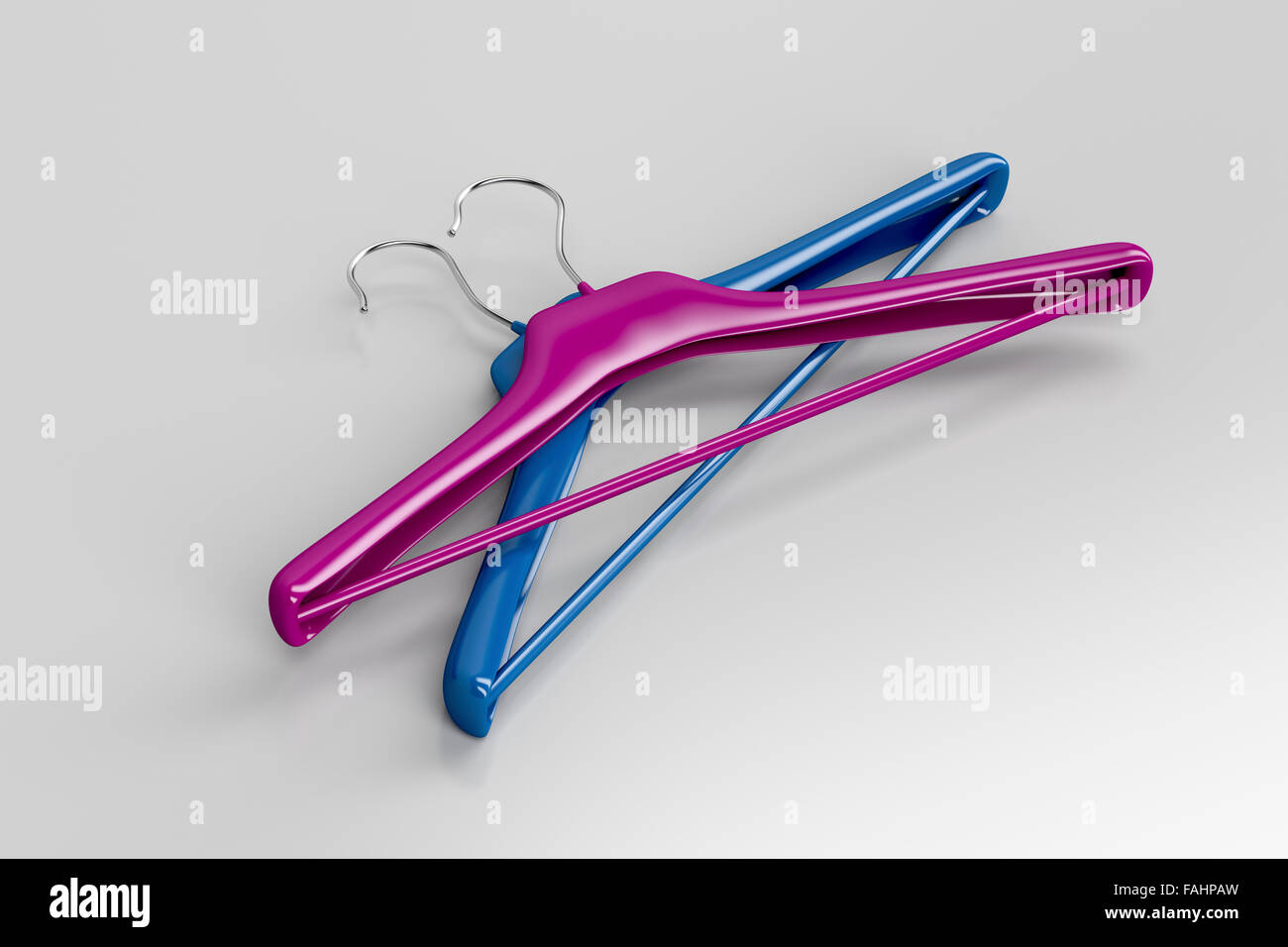 Purple and blue coat hangers on gray background Stock Photo Alamy