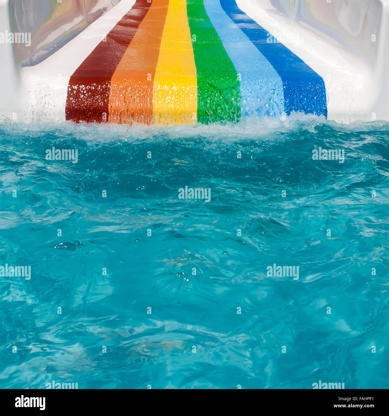 Colorful slide at aquapark in a sunny day. Stock Photo