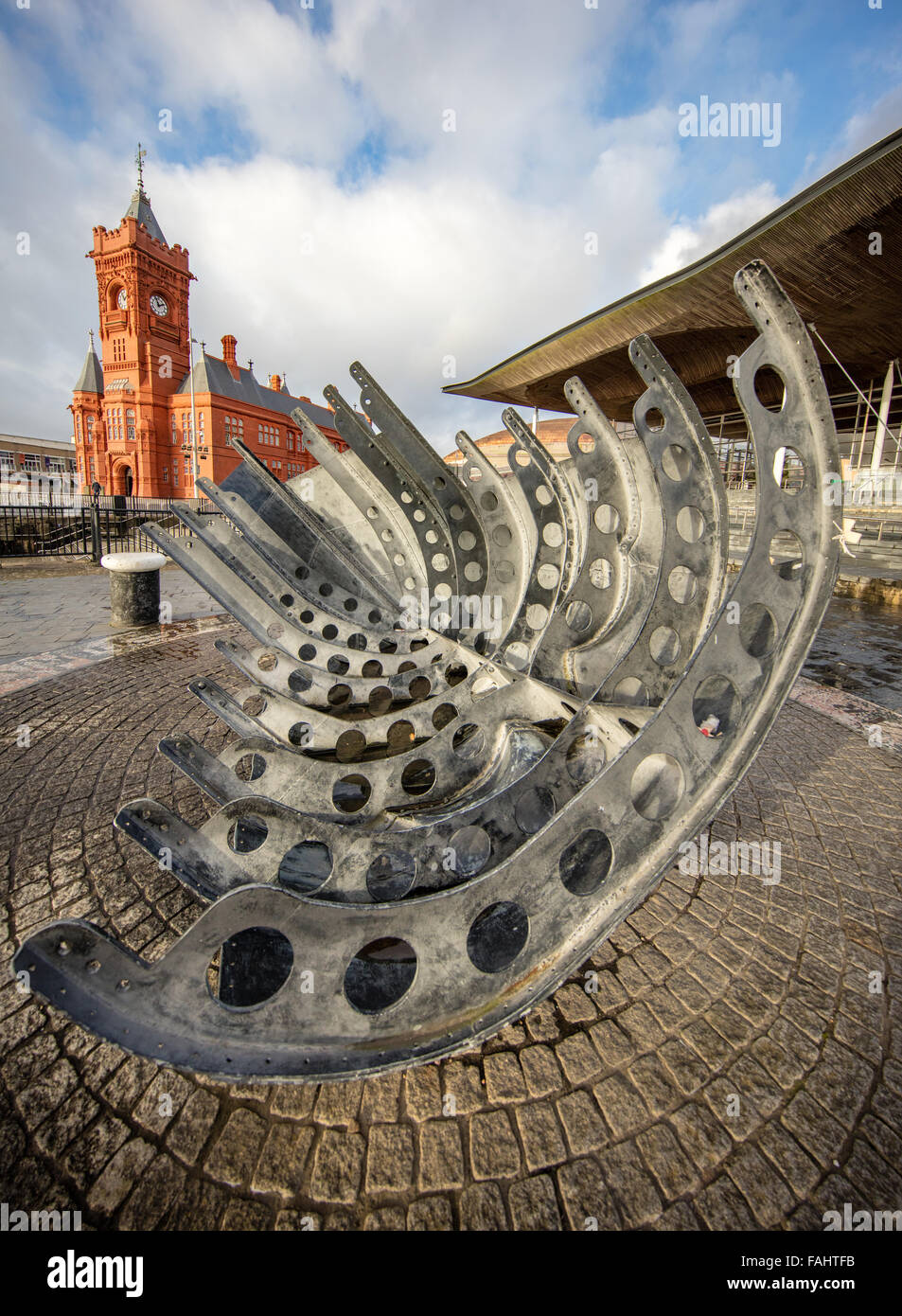 Merchant Seafarer's Memorial Sculpture and the Pierhead Building at Cardiff Bay South Wales Stock Photo
