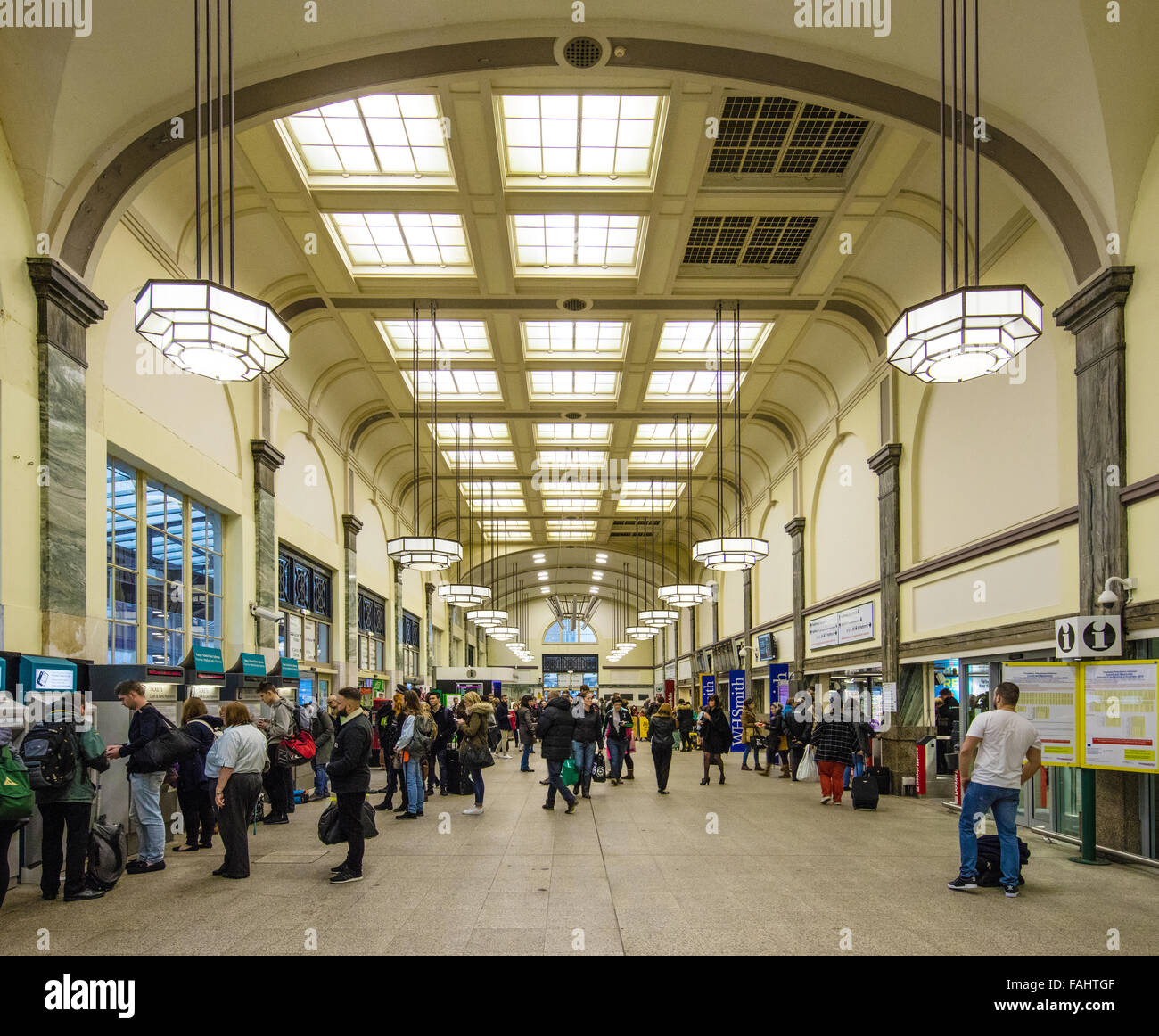 Art Deco interior of Cardiff Central railway station in Wales busy with evening commuters Stock Photo