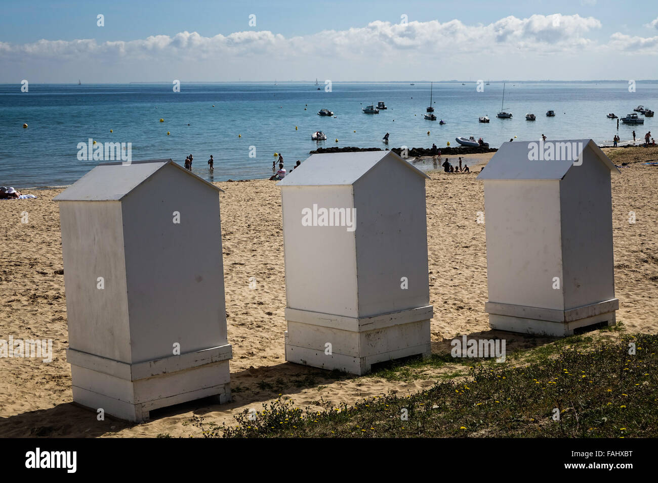 White beach huts on isle de re, France sunny blue sky tourist destination. Isle de Ré Charente Maritime Stock Photo